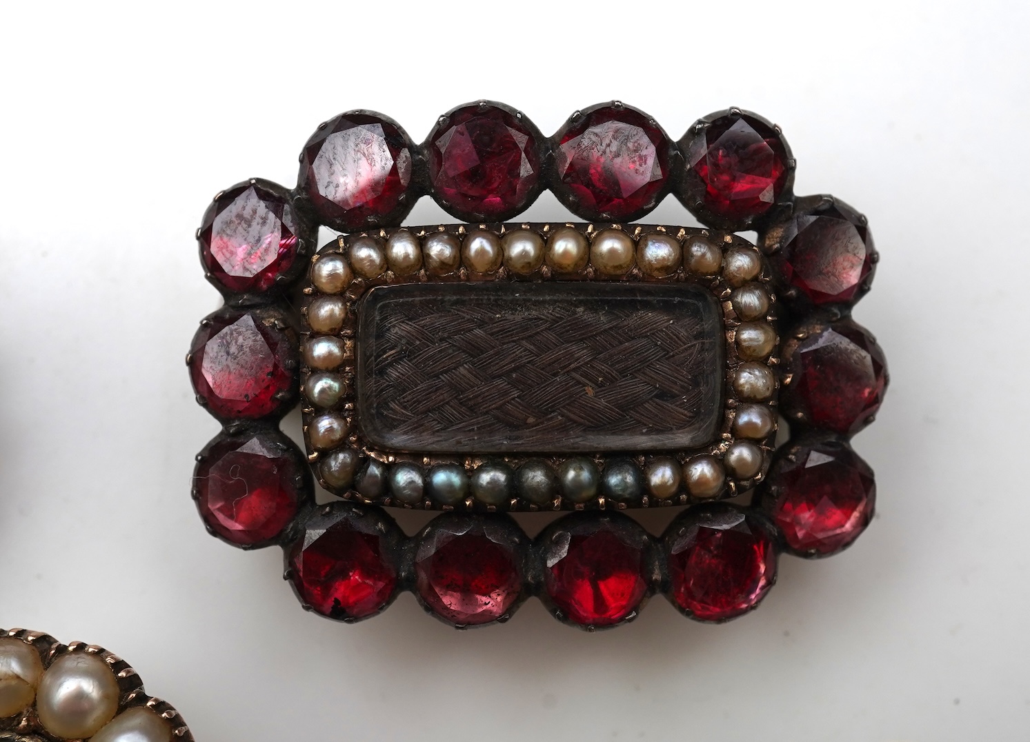 A collection of five Georgian/Victorian brooches, circa 1800-1900